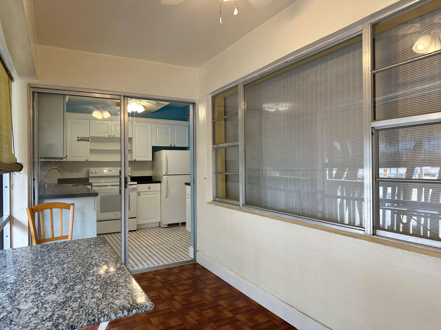 100 Royal Palm Way, Unit 2010 Boca Raton, FL 33432 - Photo 4 of 31 a kitchen with stainless steel appliances kitchen island granite countertop a refrigerator and stove
