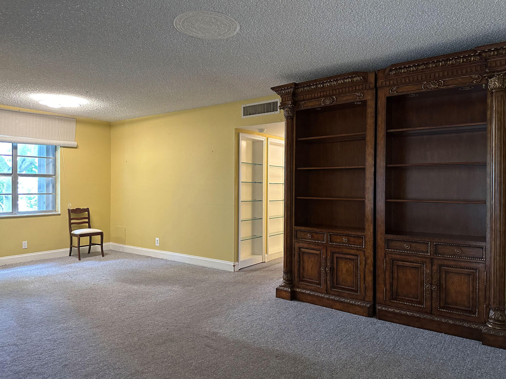 100 Royal Palm Way, Unit 2010 Boca Raton, FL 33432 - Photo 7 of 31 a view of an empty room with furniture and wooden shelves