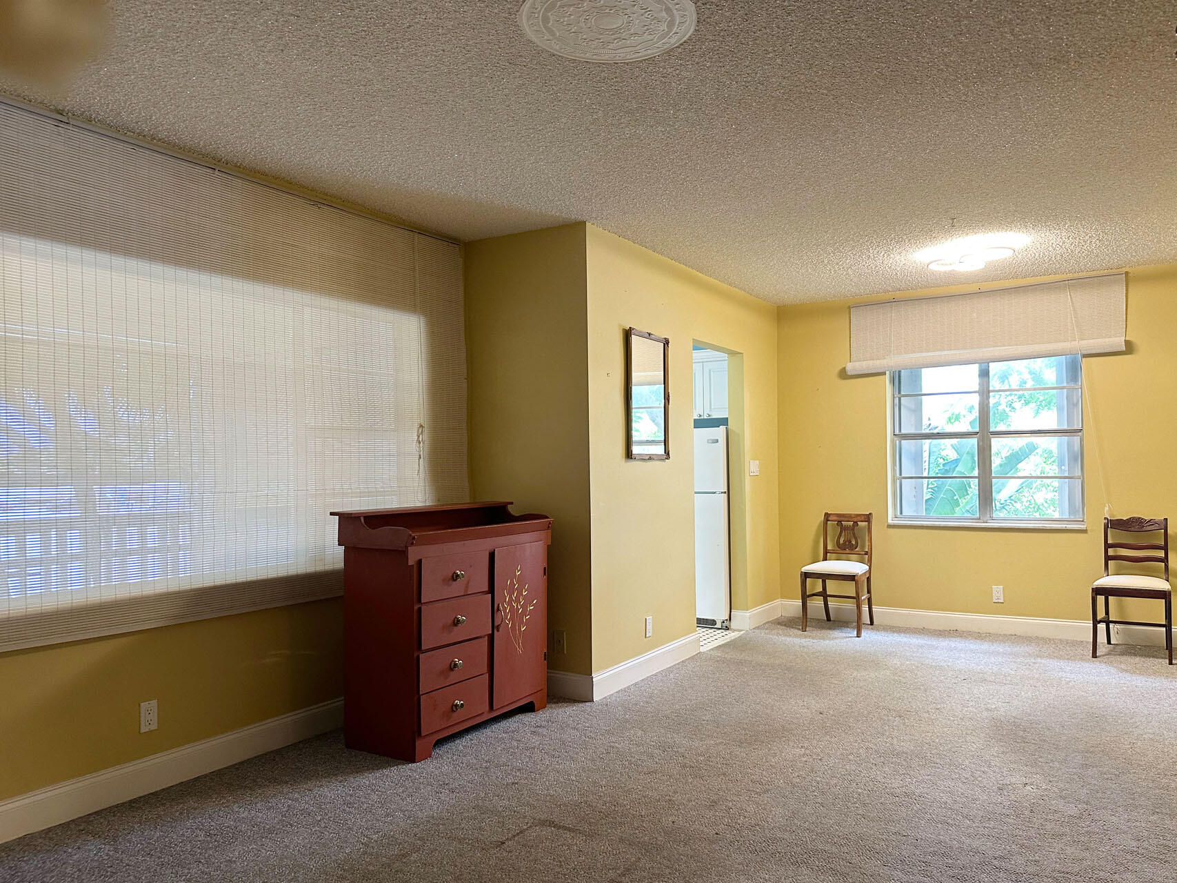 100 Royal Palm Way, Unit 2010 Boca Raton, FL 33432 - Photo 9 of 31 a spacious bedroom with a bed and a dresser