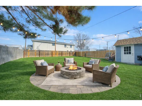 a view of a yard with patio