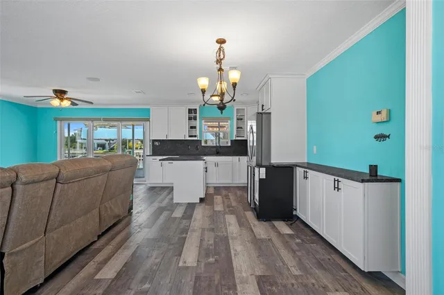 a view of a room that has a bed and a window