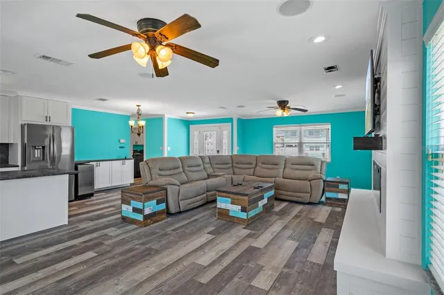 a living room with furniture and a fireplace