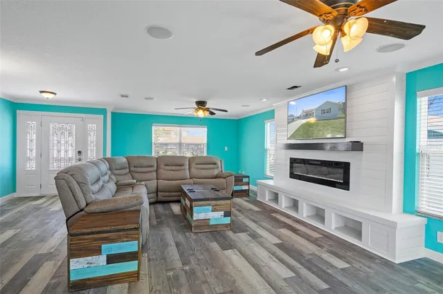 a living room with furniture and a fireplace