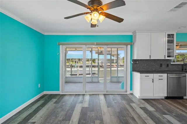 a view of room with window and ceiling fan