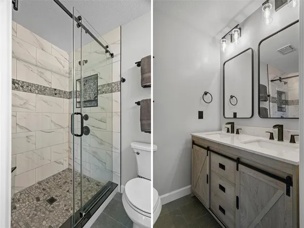 a bathroom with a shower a toilet and sink