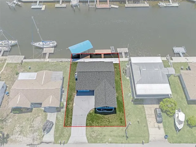 an aerial view of a house with swimming pool