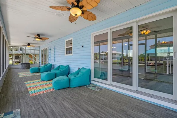 a view of a house with backyard and porch