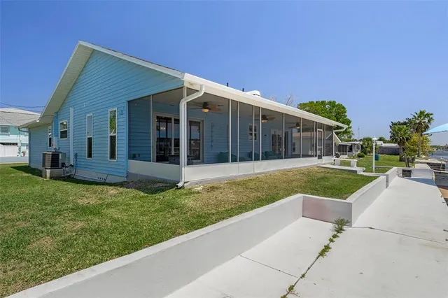 a view of a lake with a lounge chairs