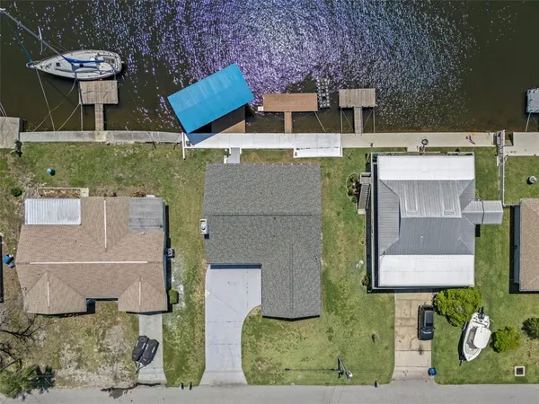 an aerial view of a house with outdoor space