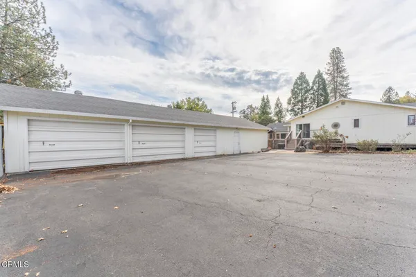 a view of a garage with a table and chairs