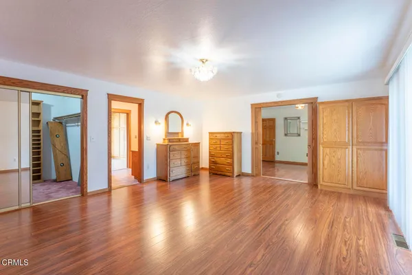 a view of a livingroom with wooden floor