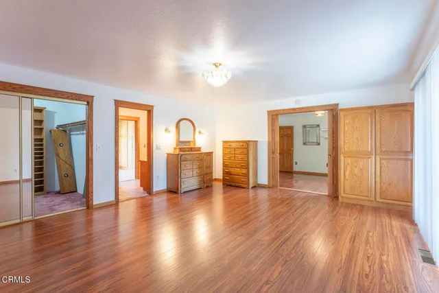 a view of a livingroom with wooden floor