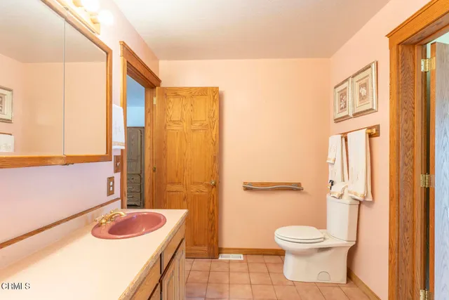 a bathroom with a sink a toilet and tub