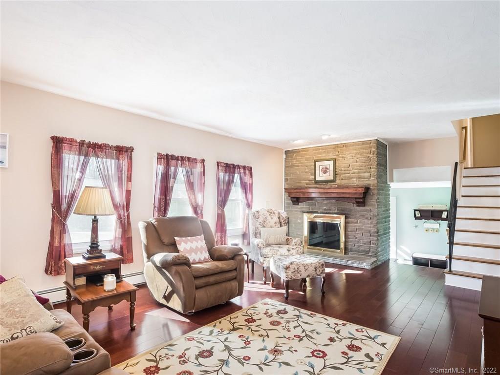 Living room with wood burning fireplace; 976 Shewville Road, Ledyard CT 06339