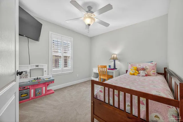 a bedroom with furniture and a window