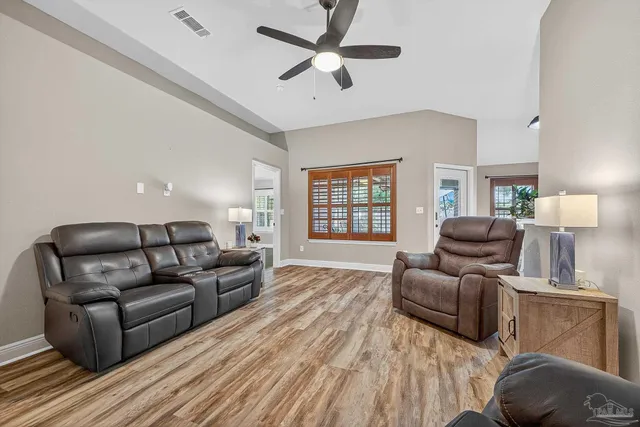 a living room with furniture and a window
