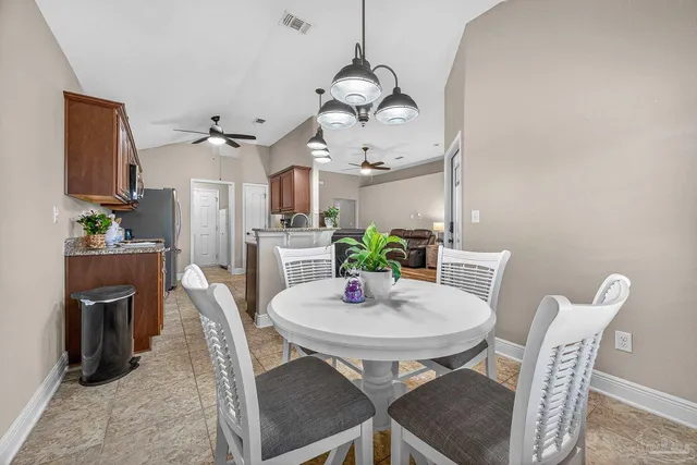 a view of a dining room with furniture