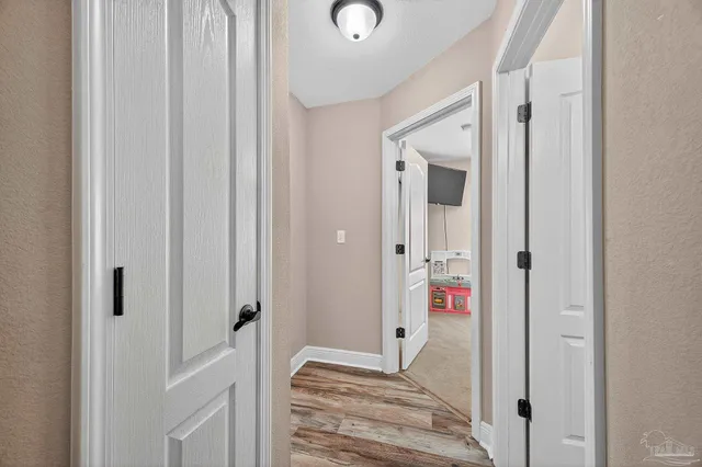 a bedroom with a bed and a mirror