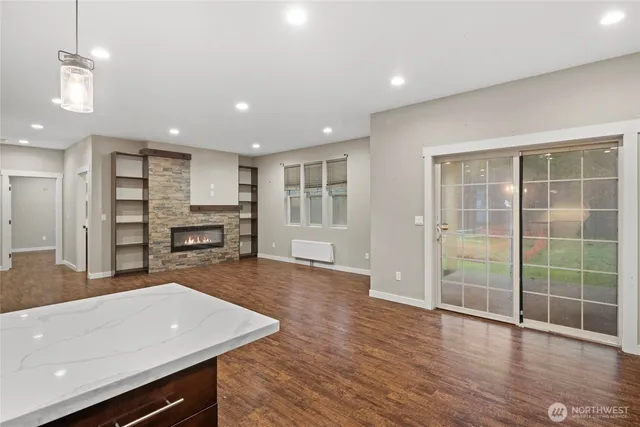 a view of kitchen with cabinets and wooden floor