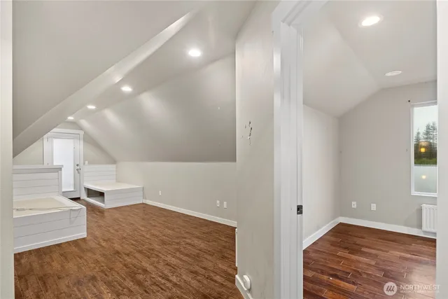 a view of empty room and wooden floor