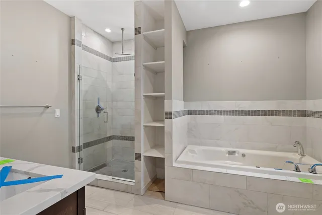 a bathroom with a bathtub and a shower