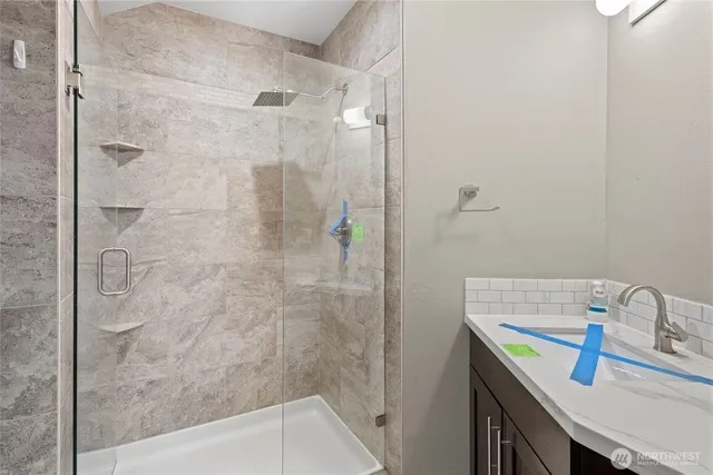 a bathroom with a sink and a shower