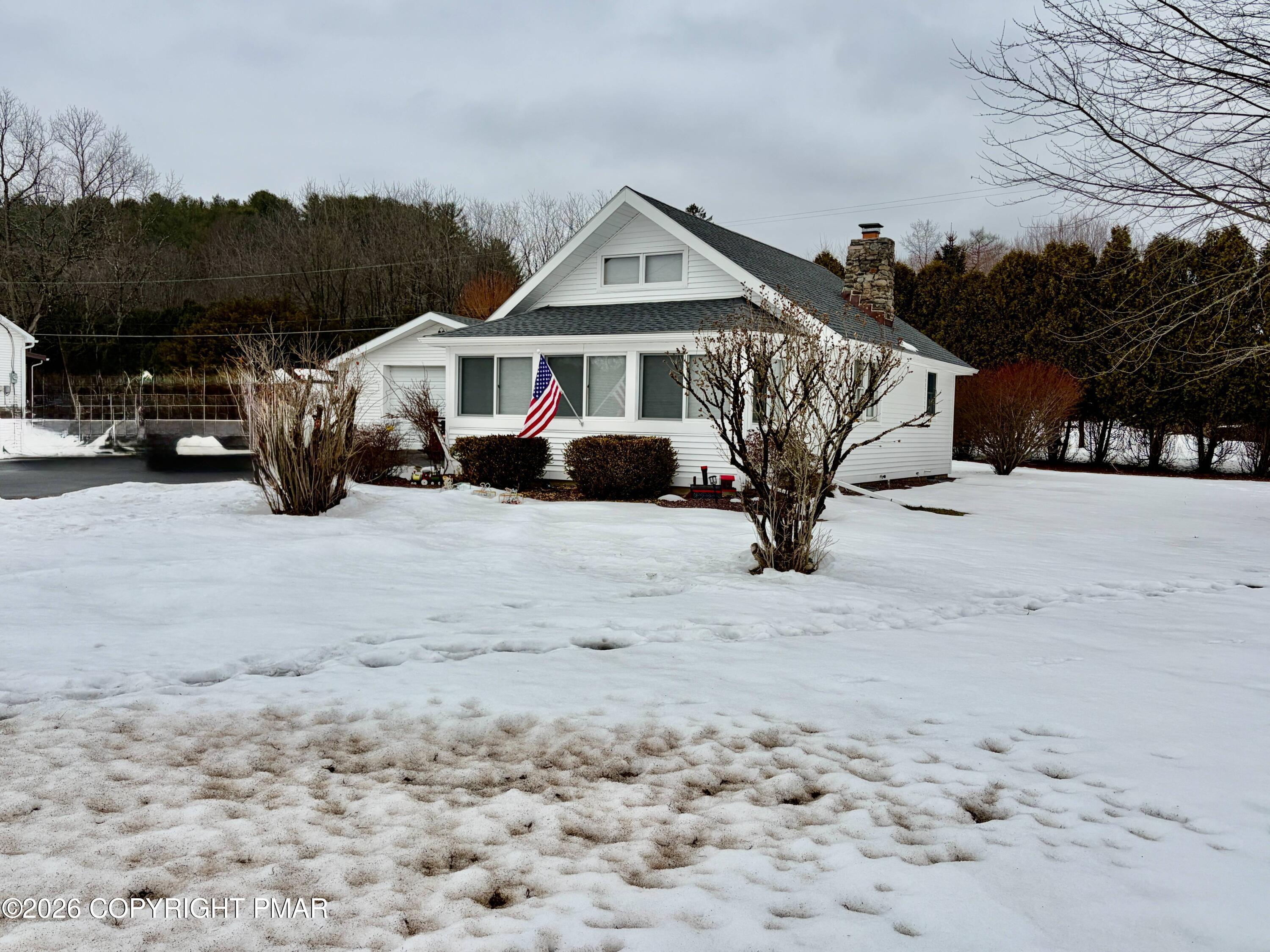 108 Rinker Drive Effort, PA 18330 - Photo 1 of 20 a view of a house with large trees in front of house