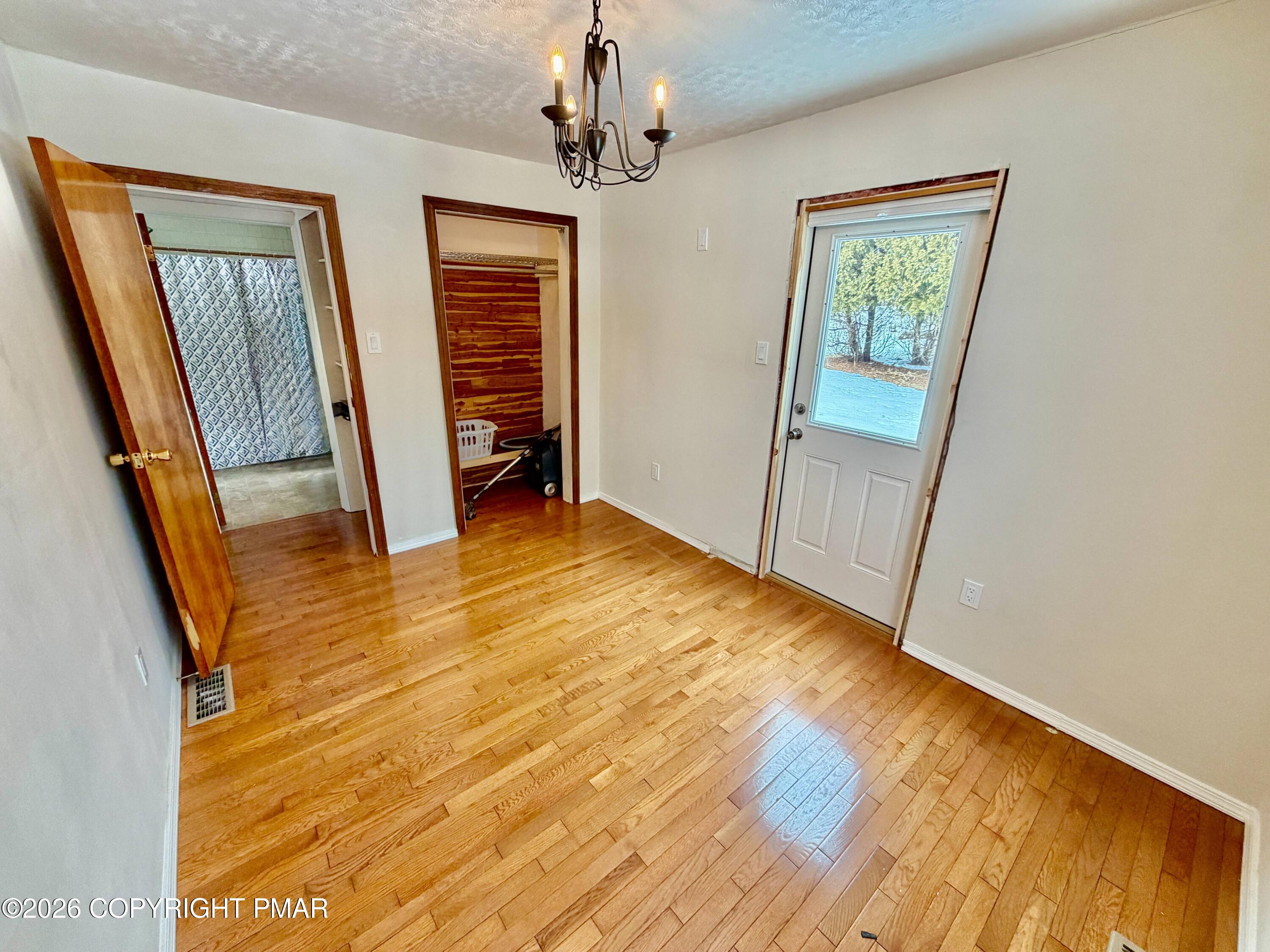 108 Rinker Drive Effort, PA 18330 - Photo 19 of 20 a view of empty room with wooden floor and fan