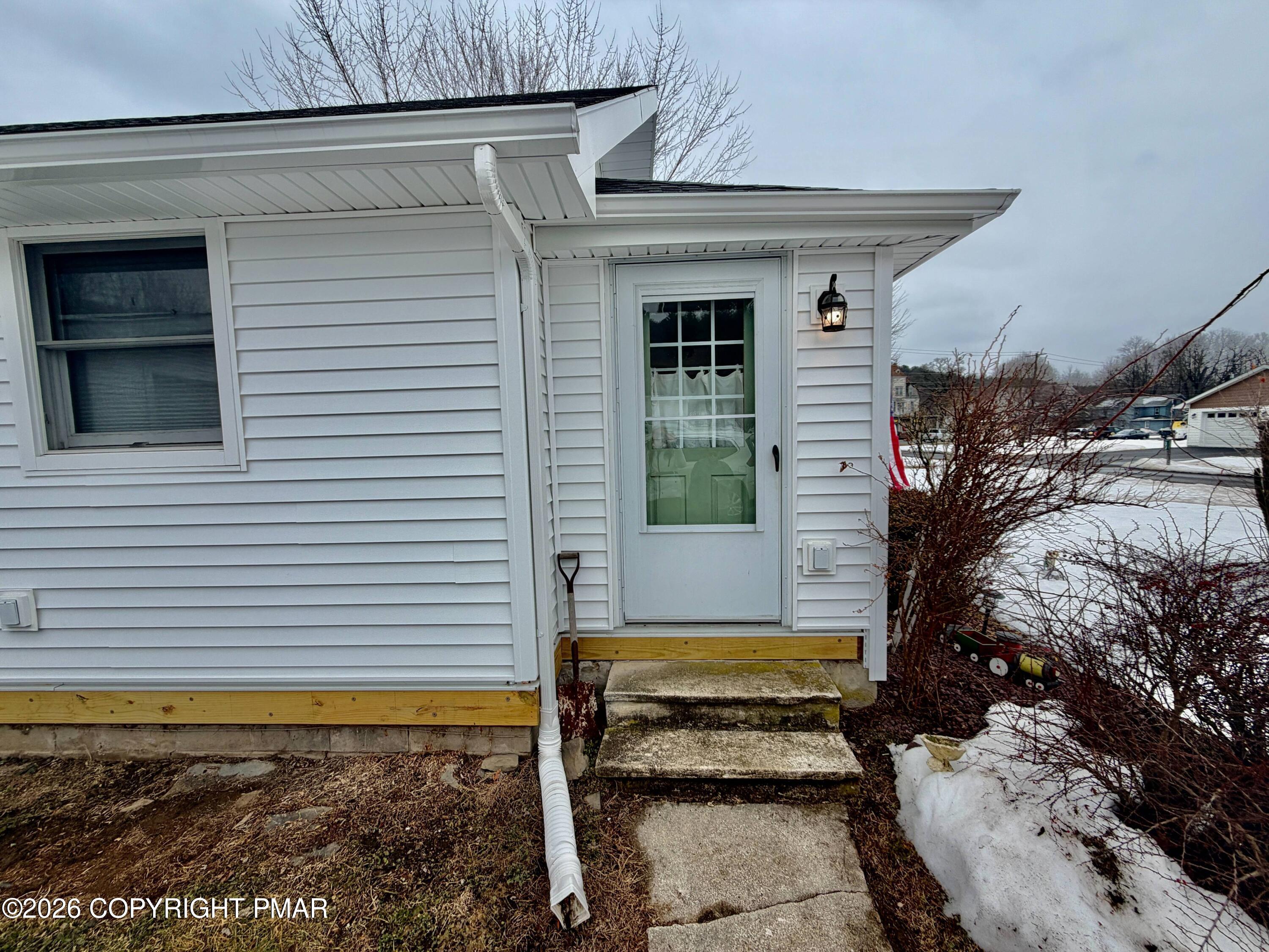 108 Rinker Drive Effort, PA 18330 - Photo 3 of 20 a view of a small house with a small yard and potted plants