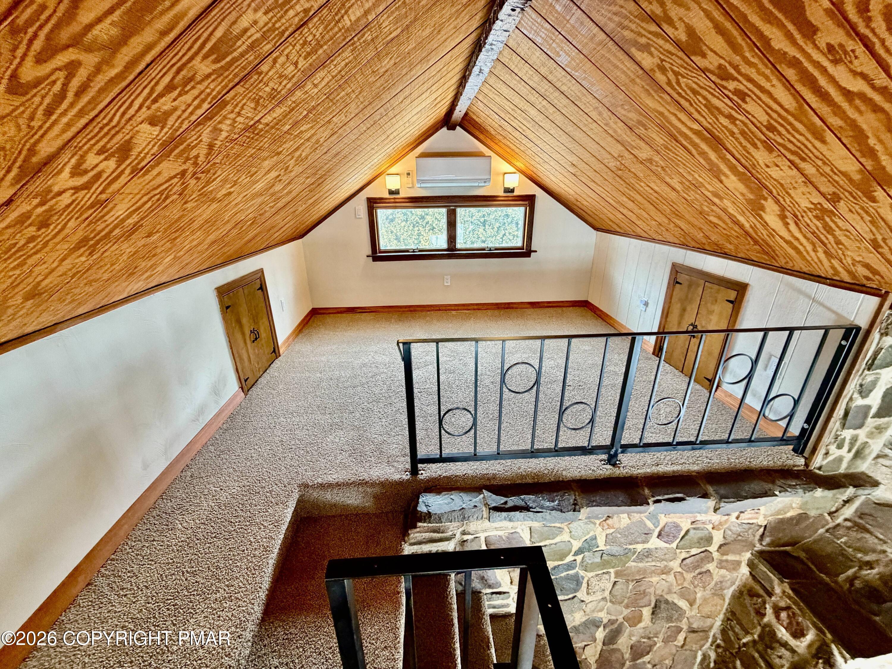 108 Rinker Drive Effort, PA 18330 - Photo 7 of 20 a view of a hallway with wooden floor and large windows