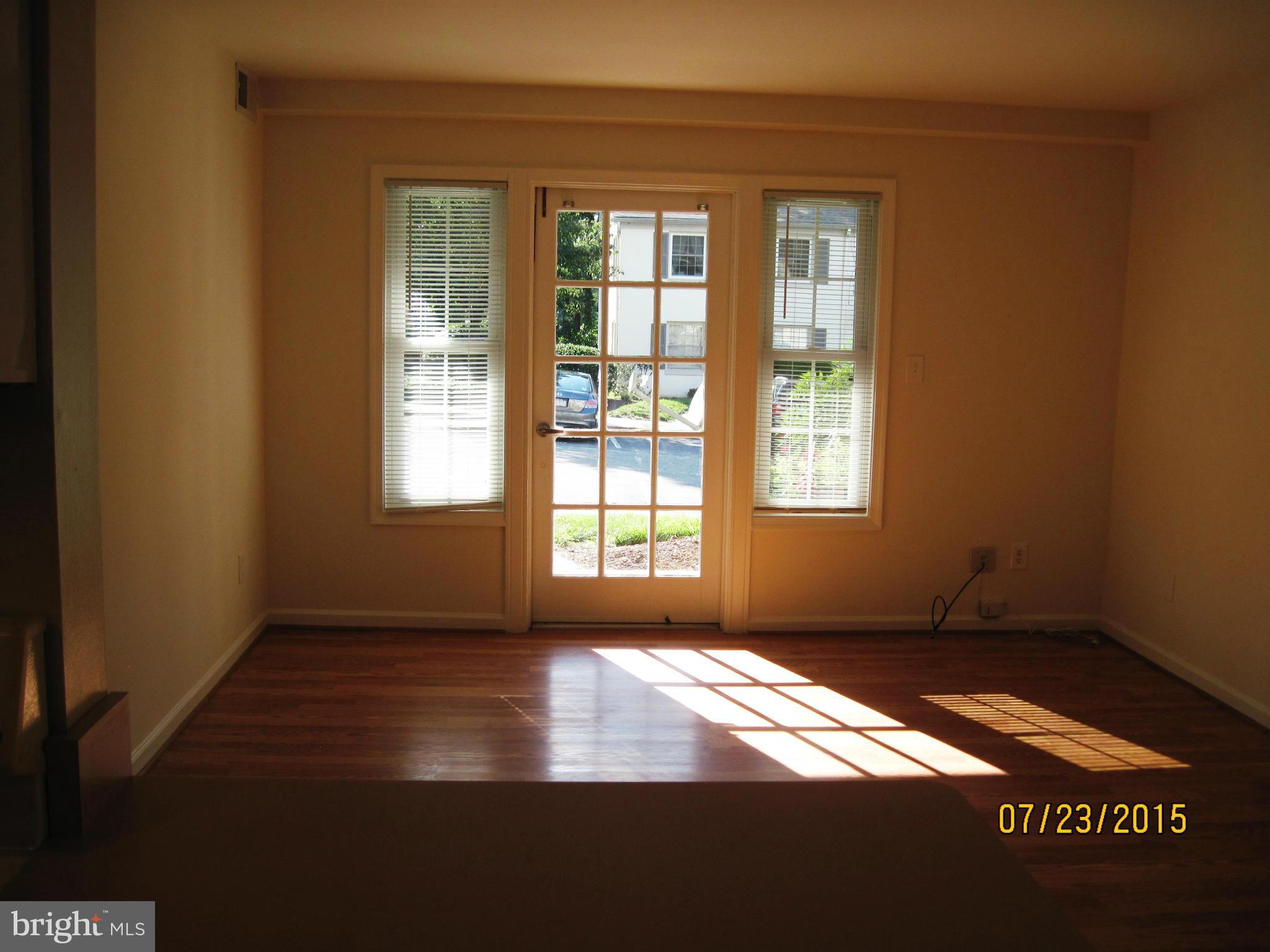 5907L Kingsford Road, Unit 395 Springfield, VA 22152 - Photo 2 of 16 Living Room With French Door to Patio