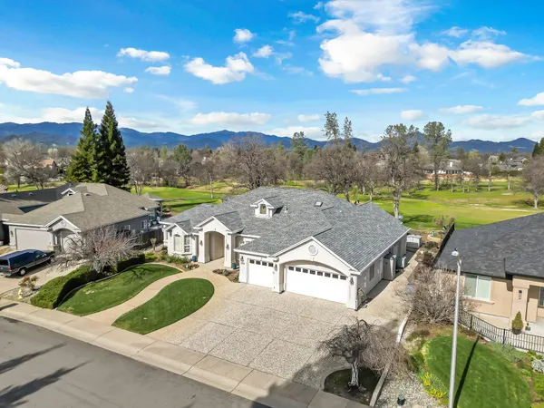 an aerial view of a house with swimming pool