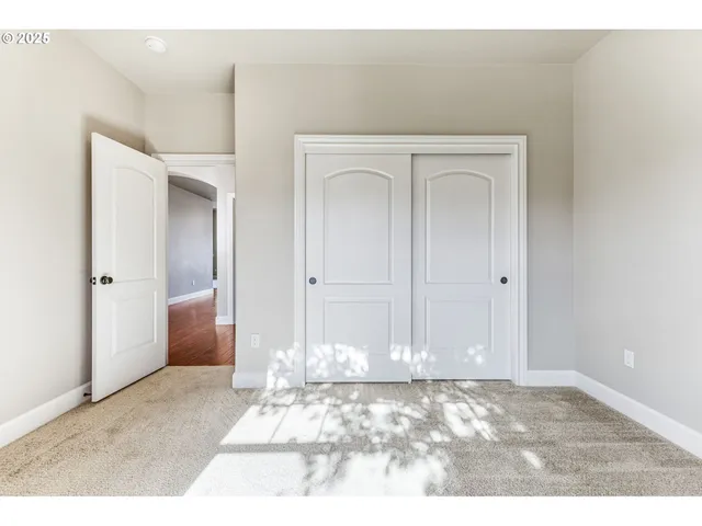 a view of a bedroom with closet