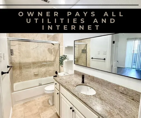 a bathroom with a sink a toilet and a shower