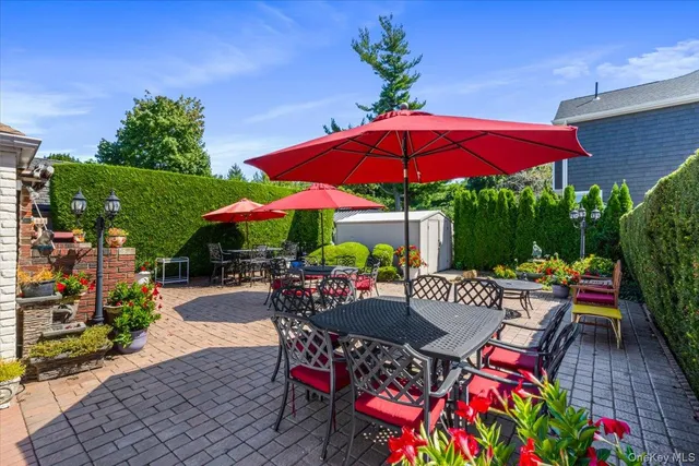 an outdoor space with furniture and umbrella