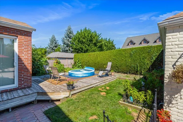 a view of a patio with table and chairs and potted plants