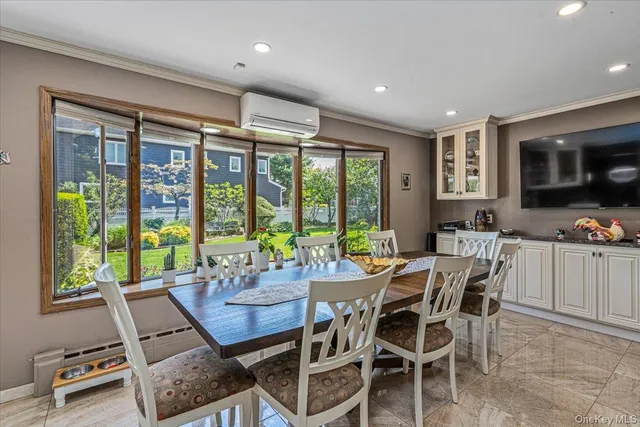 a view of a dining room with furniture window and outside view