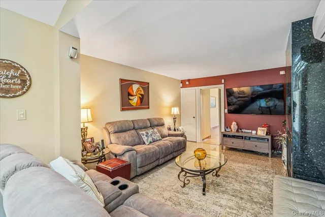 a living room with furniture and a rug