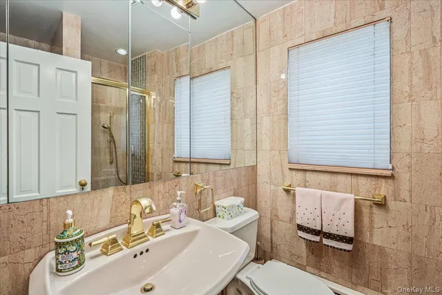 a bathroom with a sink double vanity and a mirror