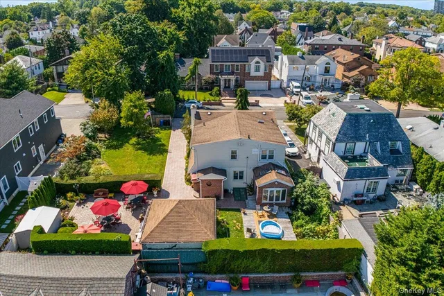 an aerial view of multiple houses with yard