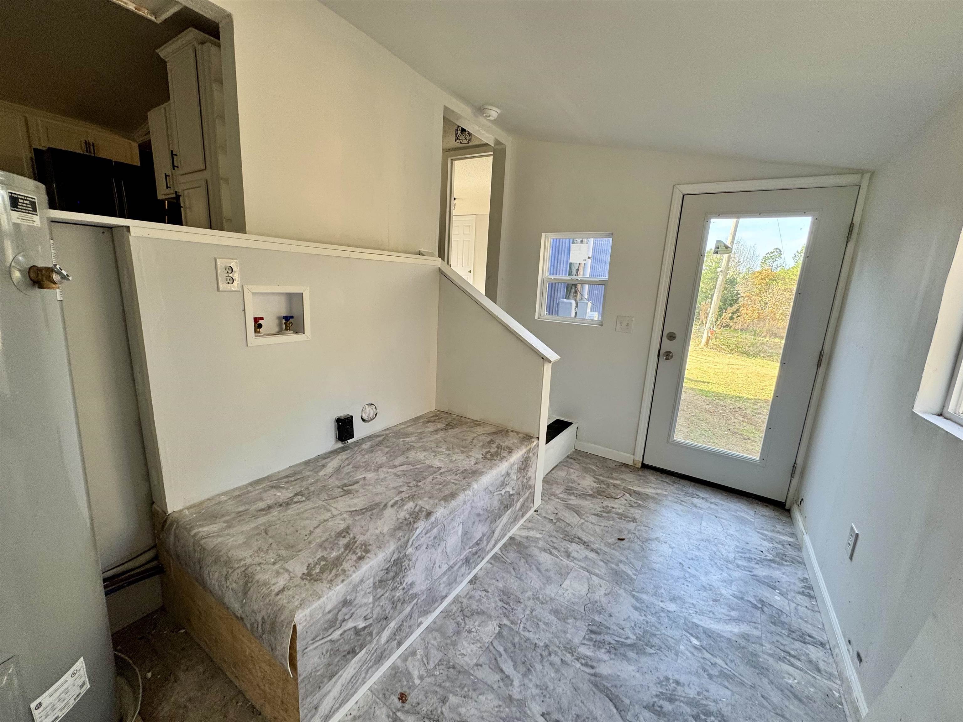 855 Beason Drive Morris Chapel, TN 38361 - Photo 16 of 21 a view of a storage & utility room with a refrigerator