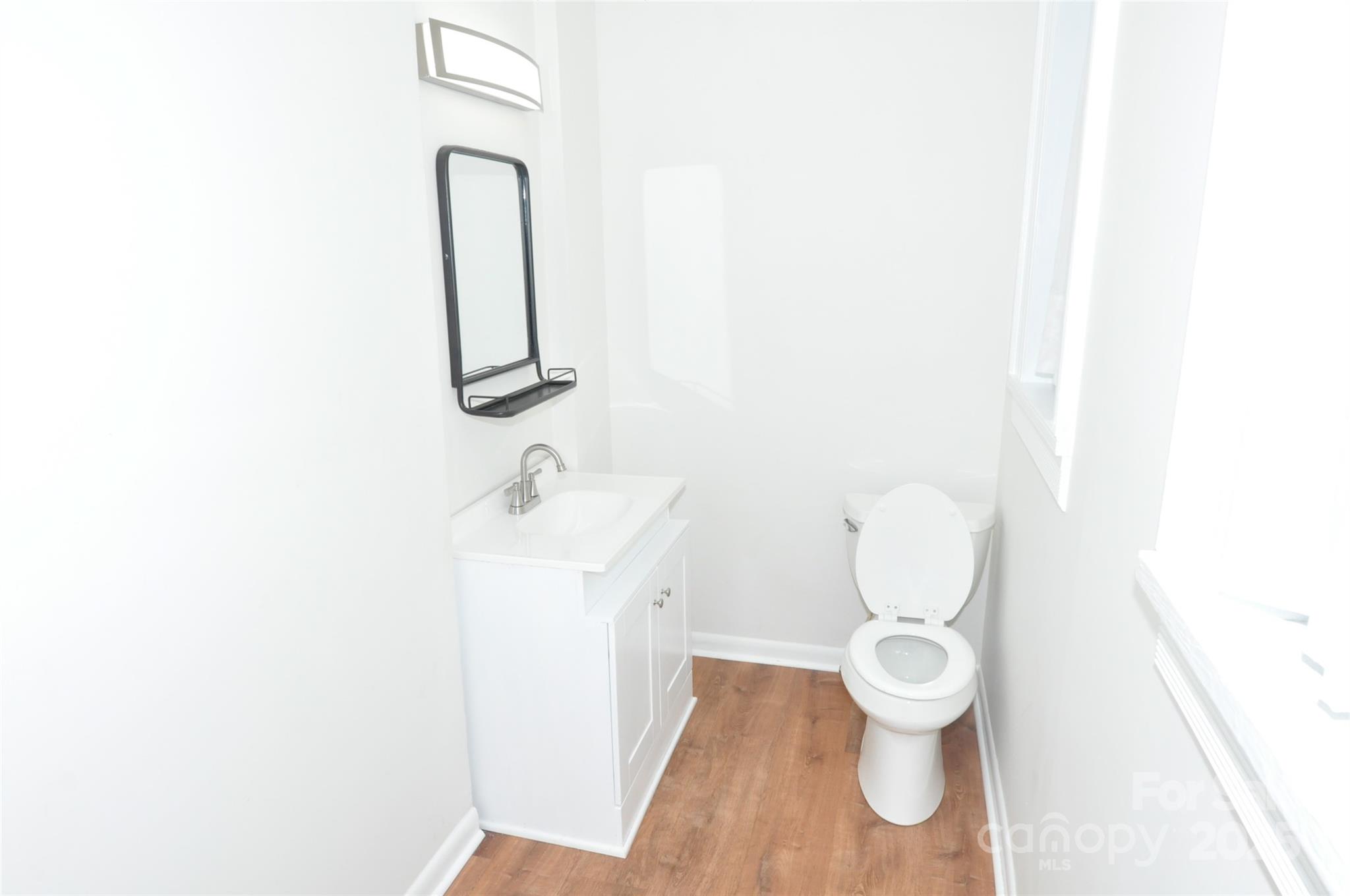 152 Saluda Street Chester, SC 29706 - Photo 16 of 24 a bathroom with a toilet sink and mirror
