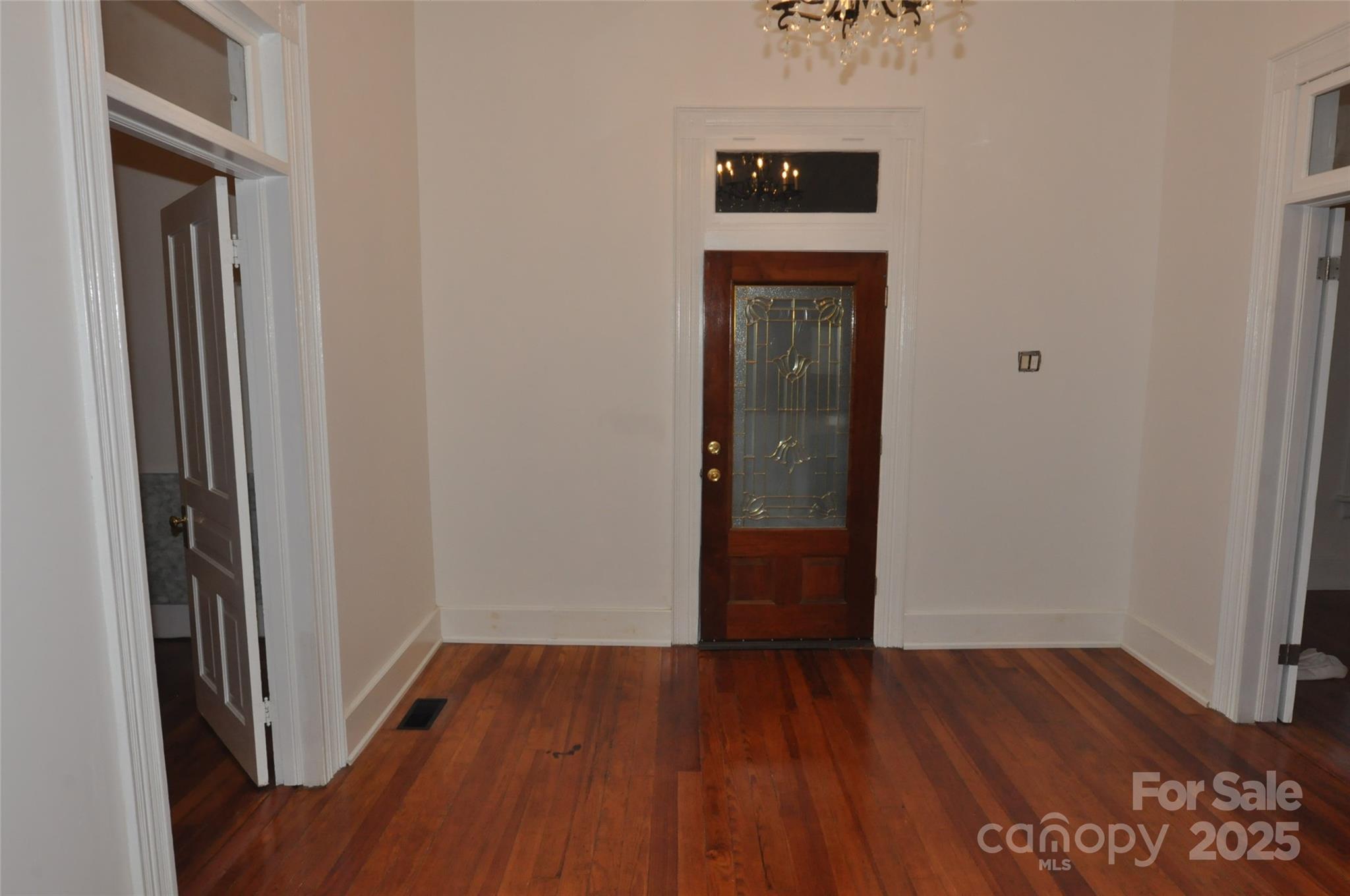 152 Saluda Street Chester, SC 29706 - Photo 6 of 24 a view of a room with wooden floor
