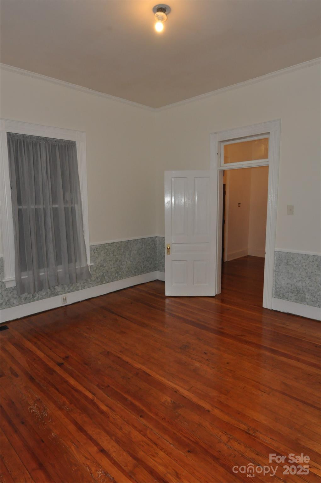 152 Saluda Street Chester, SC 29706 - Photo 8 of 24 a view of empty room with wooden floor