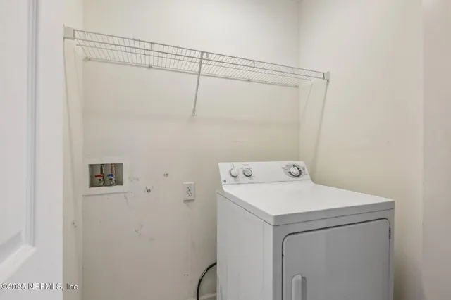 a bathroom with a sink a toilet and shower curtain