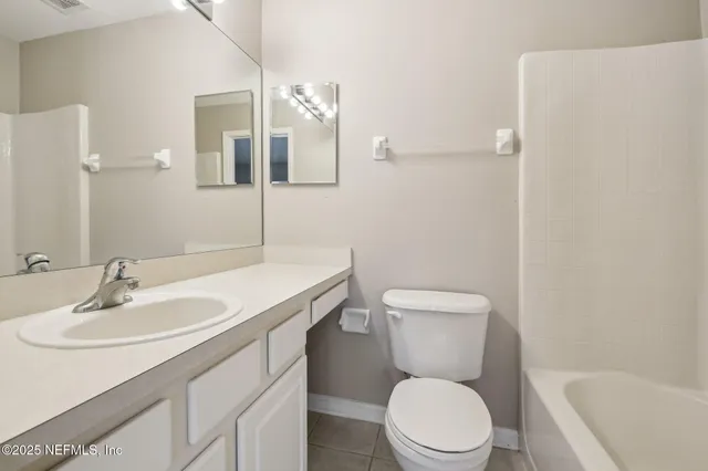 a view of a grassy field with trees