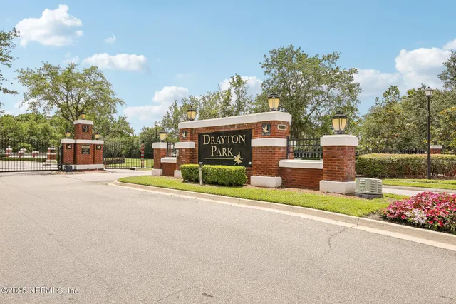 a kitchen with a refrigerator sink and cabinets