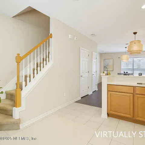 a bedroom with a bed and window with chair