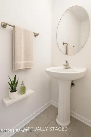 an empty room with large windows