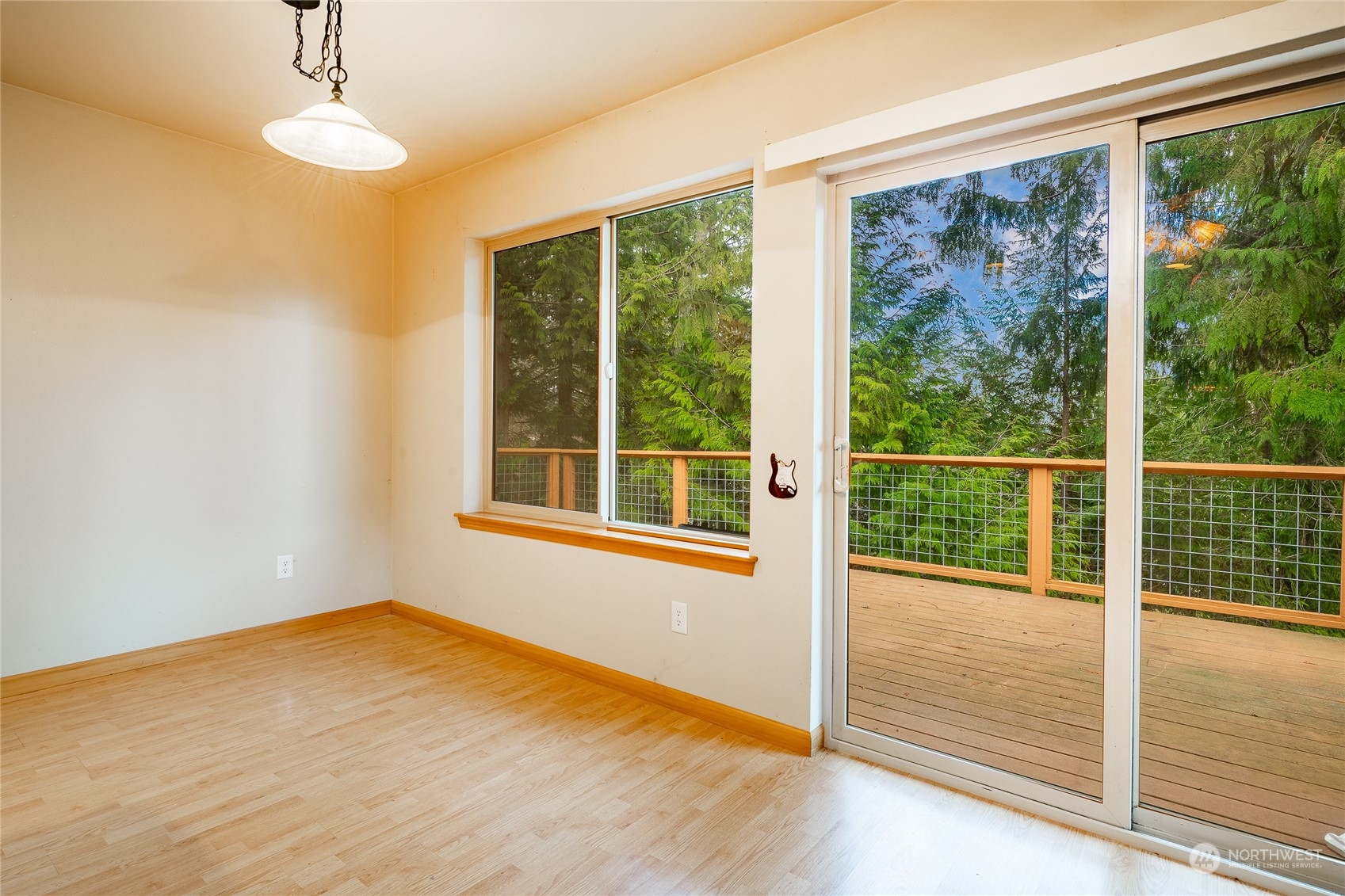 2940 Cedar Avenue Lummi Island, WA 98262 - Photo 17 of 36 a view of an empty room with wooden floor and a window